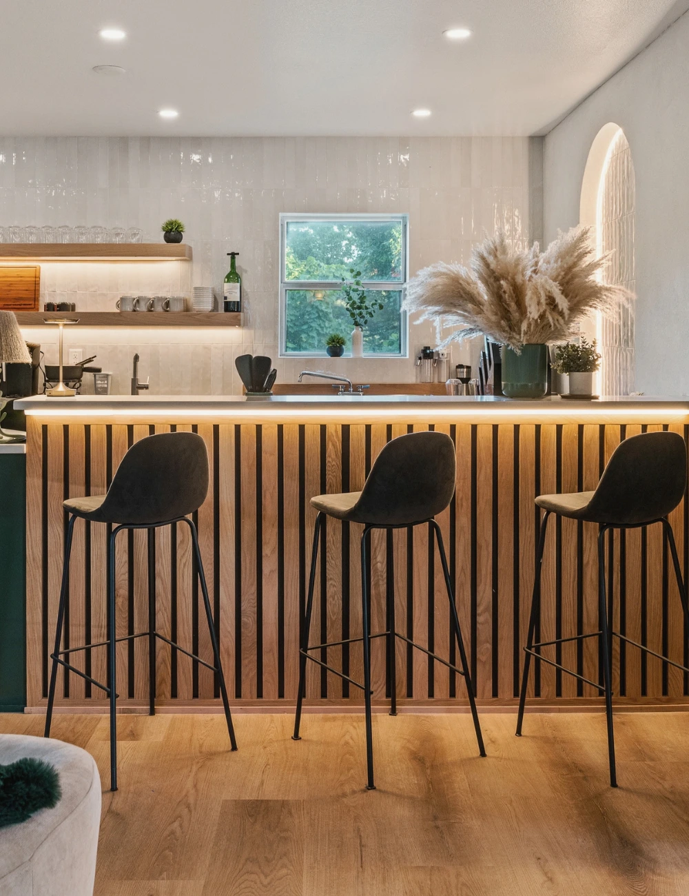 The Forest Lounge bar with wooden slat detailing and bar stools