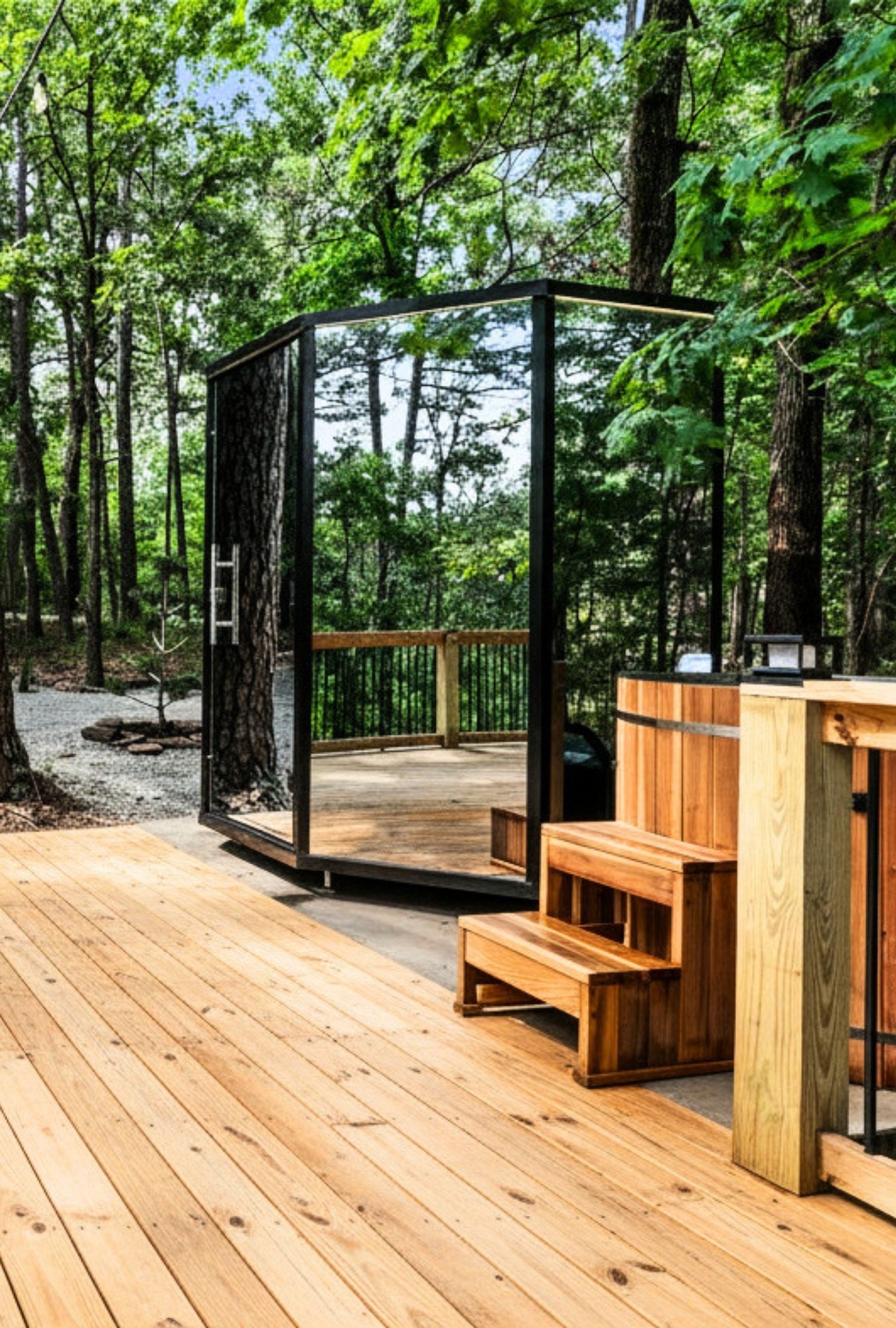 Glass-walled Nordic sauna and cedar cold plunge on a forest deck