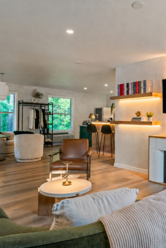 Forest Lounge interior with soft seating, bar, and warm lighting